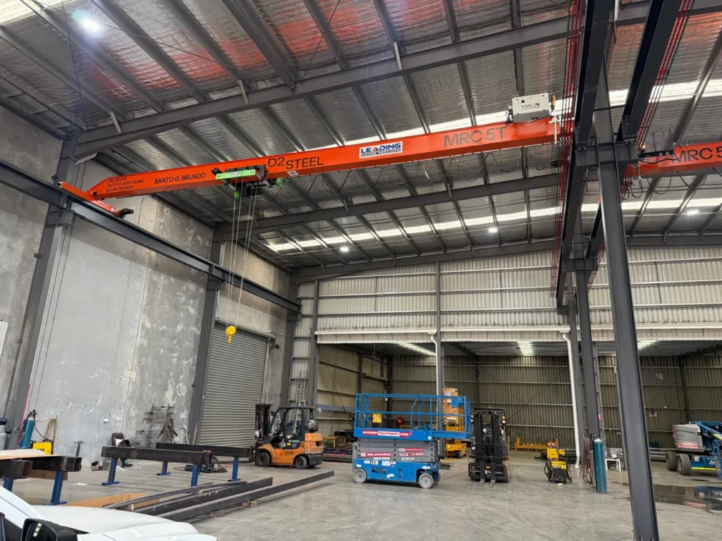 D2 Steel installation bridge crane MRC 5T operating in warehouse for heavy material handling and fabrication work
